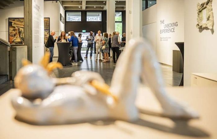Sculpture with people ar exhibit